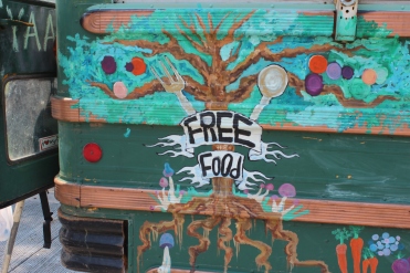 Free Food offered by hippies with a school bus converted into a kitchen at Liberty Park 2013
